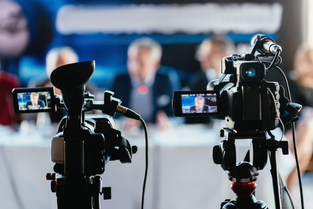 Two Cameras Recording Press Conference